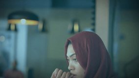 Animation of level up text over biracial woman in hijab using smartphone. Global video game, finance, business, connections, computing and data processing concept digitally generated video. - Powered by Shutterstock - Get 15% off with code: PIKWIZARD15