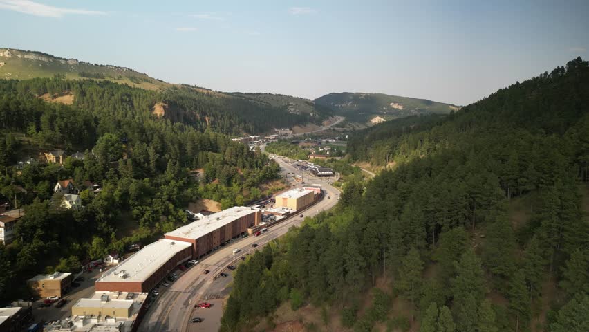 Aerial above downtown historic Deadwood South Dakota in Summer in Black Hills