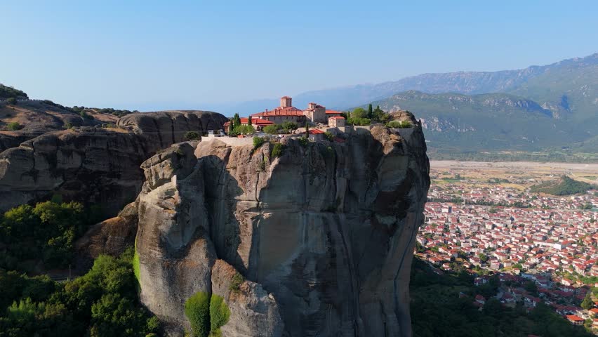 Greece Meteora region unique mountain formations and monasteries on it 4k videos taken with drone at sunrise