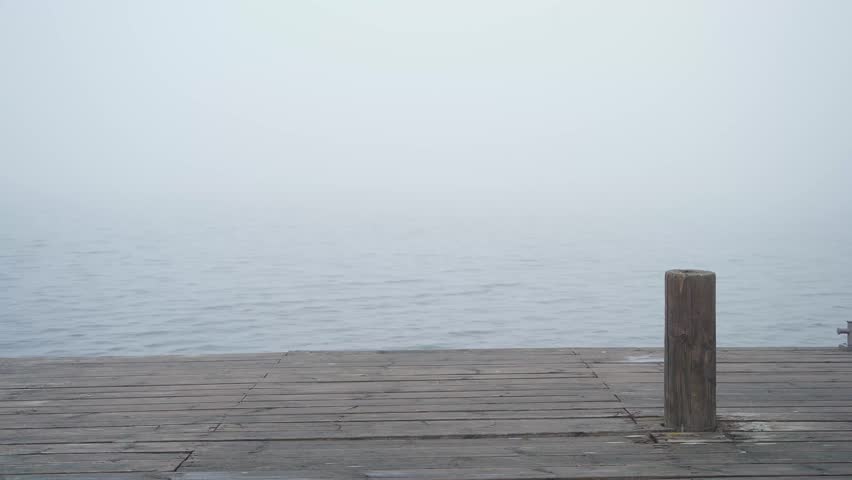 Wooden dock on a misty morning in finland