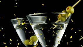 Martini glasses with olives and golden confetti animation. Cocktails, celebration, festive, luxury, party, drinks - Powered by Shutterstock - Get 15% off with code: PIKWIZARD15