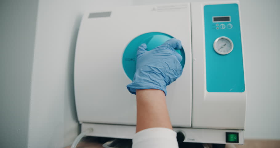 Hands, dentist and oven with dental tools for sanitizing and appointment, oral hygiene and teeth care. Doctor, gloves and equipment for routine tooth exam at orthodontist office with disinfectant