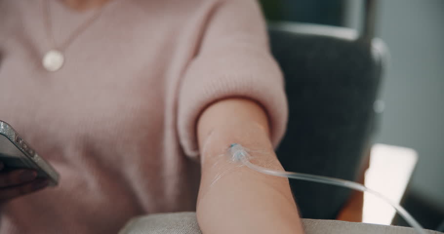 Arm, vitamins and woman on iv drip in clinic for healthcare treatment, medication or healing. Medical checkup, infusion and patient in hospital office for wellness, nutrition or natural medicine.