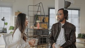 Asian Friendly happy diverse team workers talking laughing drinking coffee together in office,cheerful workers staff group chatting sharing story enjoying having fun at work,good relations at break - Powered by Shutterstock - Get 15% off with code: PIKWIZARD15