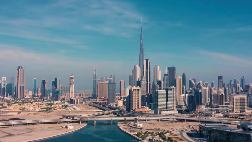 Amazing panning aerial video shot of Downtown Dubai commercial area high rise skyscrapers during sunset in modern futuristic city district - Dubai, UAE, Corporate world at Dubai with business world bu