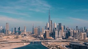Amazing panning aerial video shot of Downtown Dubai commercial area high rise skyscrapers during sunset in modern futuristic city district - Dubai, UAE, Corporate world at Dubai with business world bu - Powered by Shutterstock - Get 15% off with code: PIKWIZARD15
