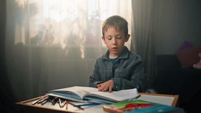 Child Reading Book in Children's Room - Close-Up of Caucasian Boy Turning Pages and Exploring. High quality 4k footage - Powered by Shutterstock - Get 15% off with code: PIKWIZARD15