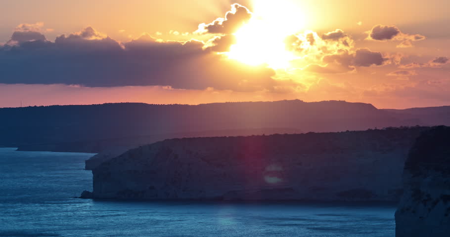 Aerial view of Kourion beach with rocks on the shore of the island of Cyprus. Nature landscape of a rocky birch tree at sunset. High quality 4k footage