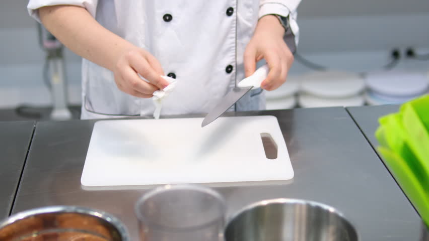 wipe dry napkin knife on the background of the board white cutting board kitchen prerequisites