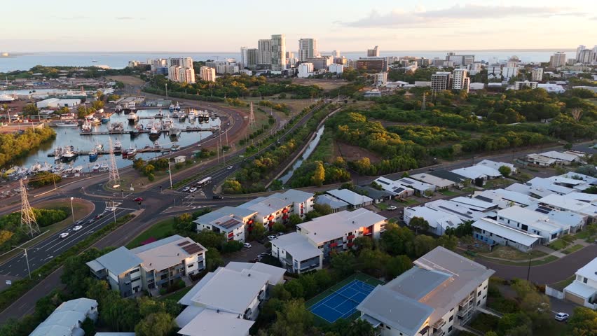Aerial drone shot of Stuart Park, Darwin, highlighting the highway and homes nestled in greenery