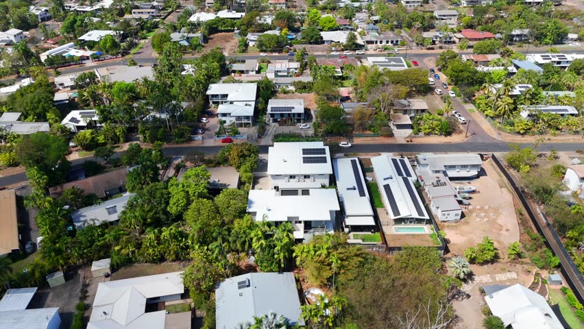 Aerial view of a residential neighborhood in Darwin City, showcasing homes, streets, and green spaces
