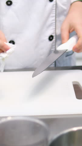 wipe dry napkin knife on the background of the board white cutting board kitchen prerequisites