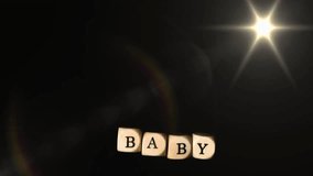 Rotating dice spelling BABY with glowing star animation on dark background. Gaming, neon, graphics, fun, playful, letters - Powered by Shutterstock - Get 15% off with code: PIKWIZARD15