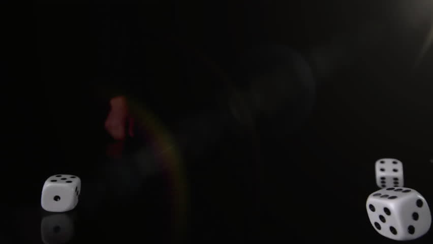 Rolling dice and bright light animation over dark background. Gambling, glowing, casino, luck, game, chance - Powered by Shutterstock - Get 15% off with code: PIKWIZARD15