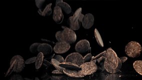 Dark chocolate chips fly and fall. Filmed on a high-speed camera at 1000 fps. High quality FullHD footage - Powered by Shutterstock - Get 15% off with code: PIKWIZARD15