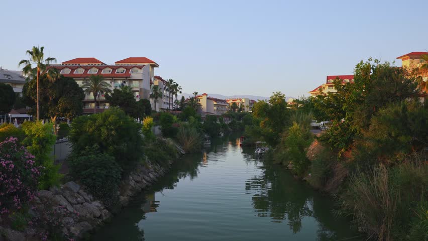 A river canal with houses on the sides.
