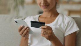 Close up unrecognizable happy smiling Indian woman Arabian lady girl female using mobile phone at home buying purchase online shopping credit bank card buy store shop internet app order food delivery - Powered by Shutterstock - Get 15% off with code: PIKWIZARD15