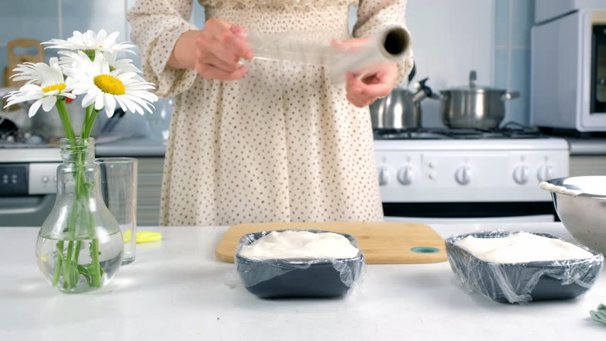 Woman cooking closing with file marshmallows mass to solidify in baking sheet on kitchen. Culinary cuisine baking food dish pastry. Preparing sweet homemade marshmallows apple dessert.