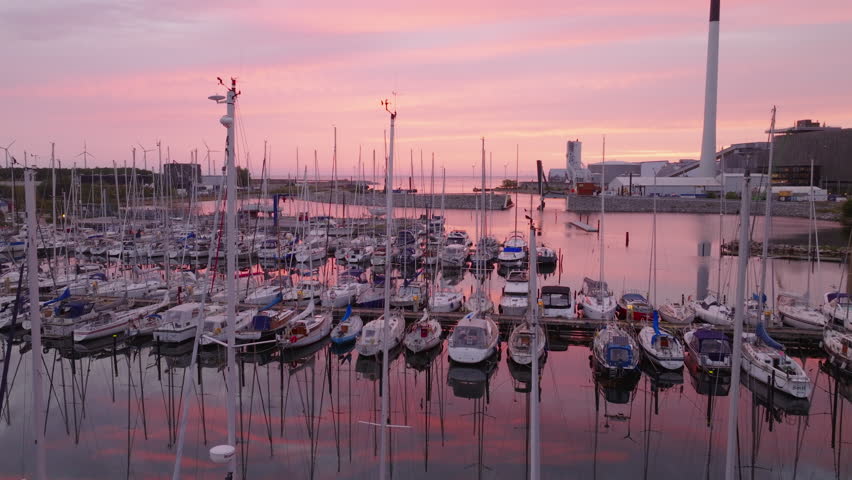 Stunning sunset paints the sky in shades of pink and orange over Copenhagen
