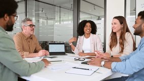 Diverse colleagues gather around a table for a brainstorming session in a stylish, open-concept office. The essence of teamwork and creative collaboration in a professional setting. - Powered by Shutterstock - Get 15% off with code: PIKWIZARD15