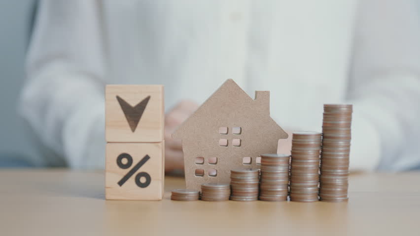 Arrow change to UP and Down with percentage, Home model and money coins stack. Real estate Mortgage, Refinance, House loan and debt, Interest rate, Insurance, Financial and Property Tax concepts