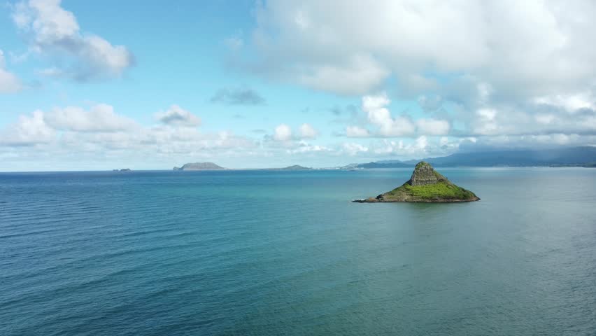 A slow rotating panning view of Mokoli’i Island in Oahu, Hawaii.