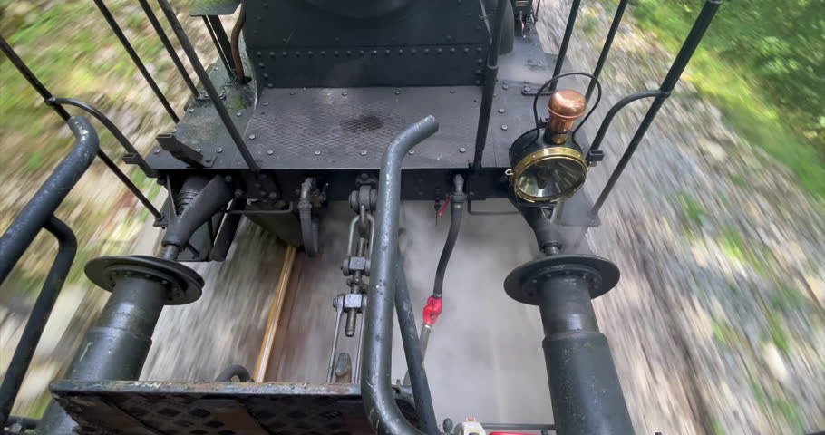 Between the locomotive and the wagon, the details come to life: the sturdy coupling connecting the two, the gleaming metal parts glistening with oil
