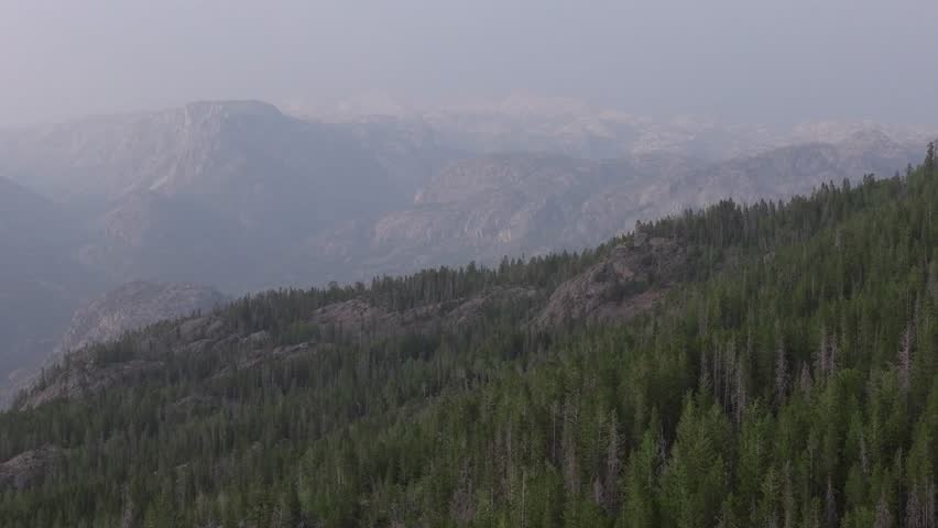 Misty view of the Wind River Range with forested mountains near Pinedale, Wyoming