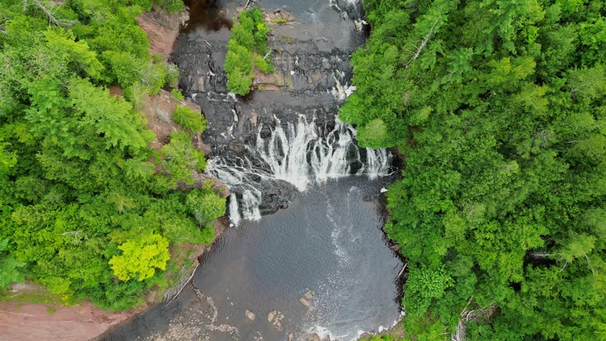 Beautiful Waterfall In Wisconsin. 4K Aerial Birds Eye Static Shot Over Potato River Falls In Northern Wisconsin.