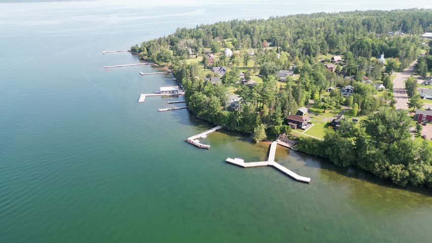 Beautiful Location Shot Over The Charming Town Of La Pointe, Ashland County, Wisconsin, USA. 4K Aerial Reverse Ascend Over The Main Ferry Port Of Madeline Island, Lake Superior.