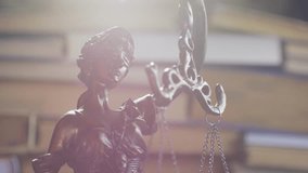 The Statue of Justice in Courtroom or Office on books background in lights. Lawyer working. Concept of attorney or court judge, justice and law - Powered by Shutterstock - Get 15% off with code: PIKWIZARD15