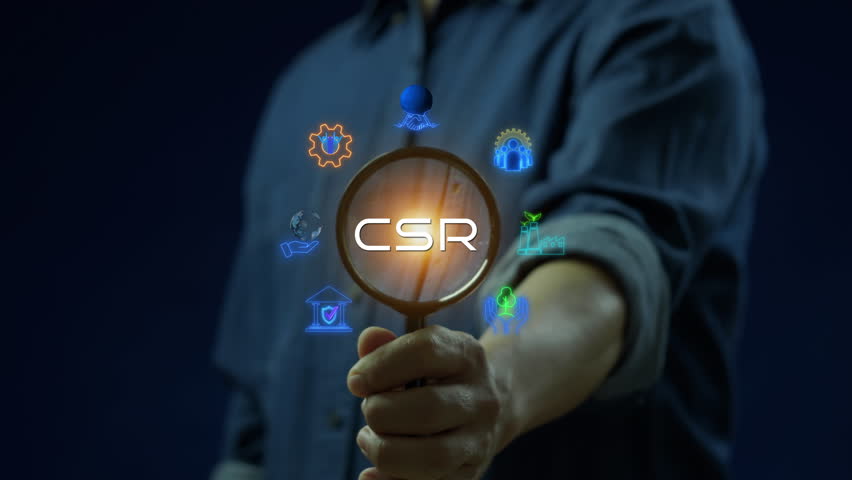 CSR concept for business and organization. Corporate social responsibility and giving back to the community. Businessman showing neon line banner of CSR icons concept on virtual screen.