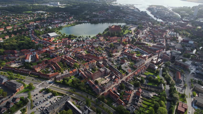 Aerial panorama around the city Kolding in Denmark on a sunny day in summer	
