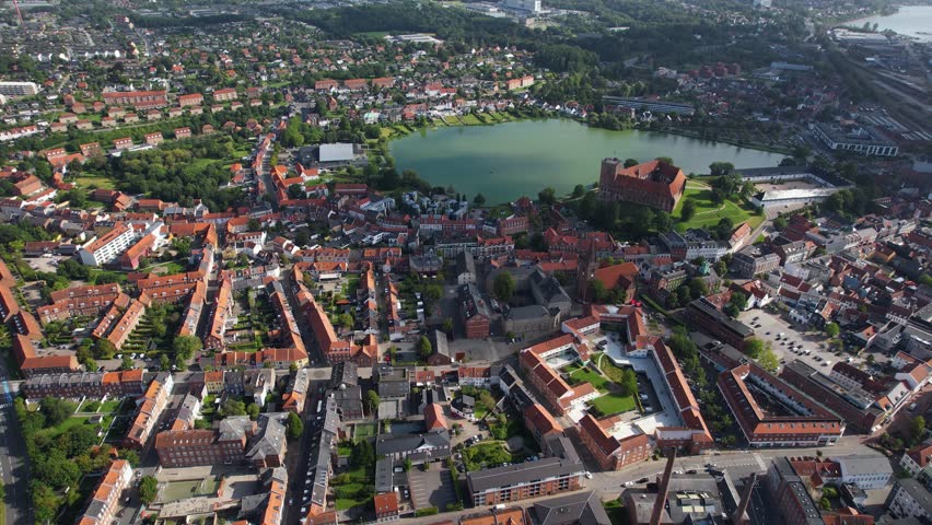 Aerial panorama around the city Kolding in Denmark on a sunny day in summer	
