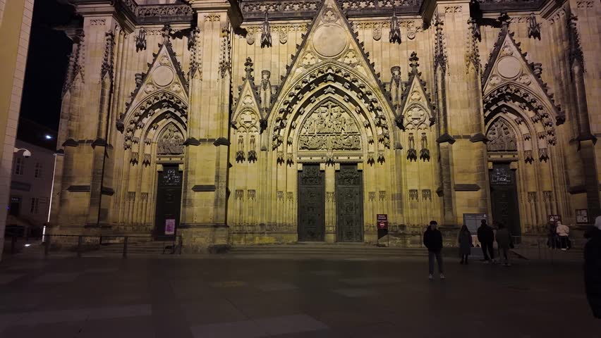 Panoramic magical night video of the illuminated entrance to the Cathedral of St. Vitus to Prague Castle