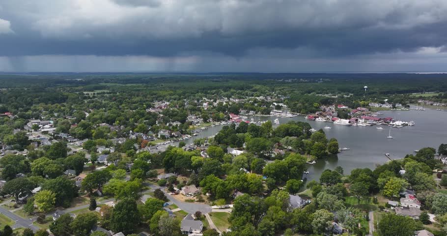 Late summer, early fall aerial, drone, video of the St Michaels Maryland skyline and the Chesapeake Bay.  September 2024.