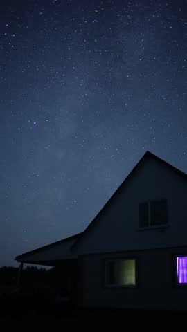 Starry sky with the Milky Way above the house