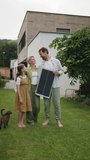 Video of family holding model of solar panel. Sustainable living, green energy in home. - Powered by Shutterstock - Get 15% off with code: PIKWIZARD15
