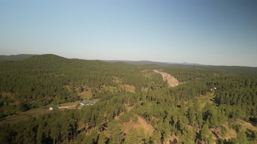 Aerial of rural mountain home in Black Hills National Forest South Dakota in summer