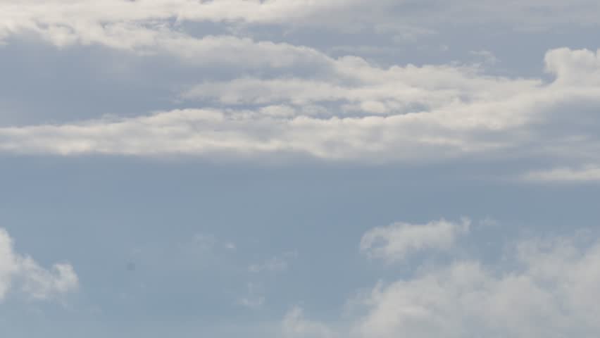 Beautiful White Cumulonimbus Fluffy Clouds Moving on the Sky. Rainy Clouds in a Slideshow on the Sky in a Summer Day.