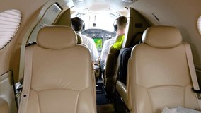 luxurious private jet’s interior plush leather seats pilots flying cockpit embodies luxury exclusivity air travel panning shot view airplane aviation business jet exclusive - Powered by Shutterstock - Get 15% off with code: PIKWIZARD15