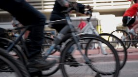 Cyclists riding through city street in motion blur, dynamic urban scene, active lifestyle, commuting, city life, cycling event, community engagement, fast-paced, exercise, transportation - Powered by Shutterstock - Get 15% off with code: PIKWIZARD15