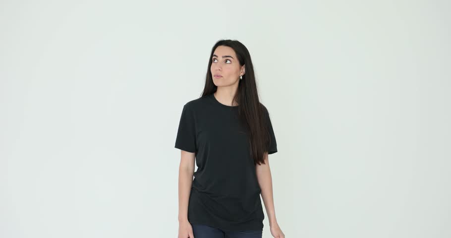 Young woman opens small red umbrella to protect head on white background. Female model with accessory performs insurance coverage concept