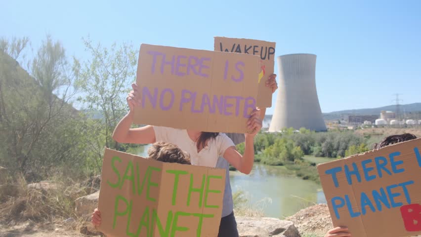 Families protesting for renewable energy and environmental protection in front of nuclear power plant