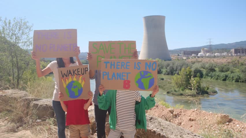 Families protesting for renewable energy and environmental protection in front of nuclear power plant