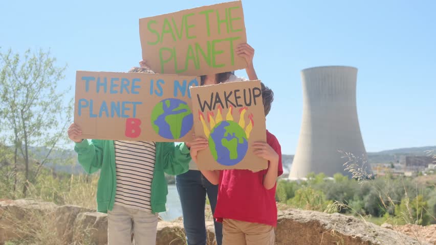 Families protesting for renewable energy and environmental protection in front of nuclear power plant