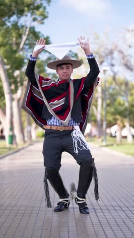 Young Chilean teenager dancer in traditional huaso costume posing, fiestas patrias celebration 