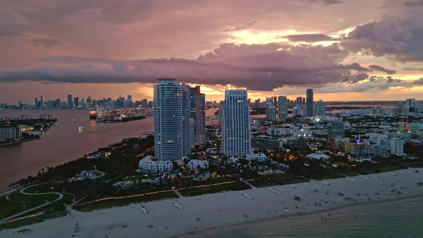 Night Miami Beach, South Beach. Night Miami Beach skyline. Night Miami cityscape, aerial view. Top view of Miami coastline, shore, waterfront near ocean. Ocean drive.
