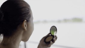 Woman put on makeup to her beautiful face for concealing wrinkles. - Powered by Shutterstock - Get 15% off with code: PIKWIZARD15