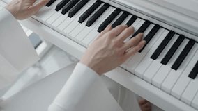 Close-up image of hands playing piano keys, showcasing musical talent and skill in a bright, elegant setting. Perfect for themes of music, creativity, and art. Close-Up of Hands Playing Piano Keys - Powered by Shutterstock - Get 15% off with code: PIKWIZARD15